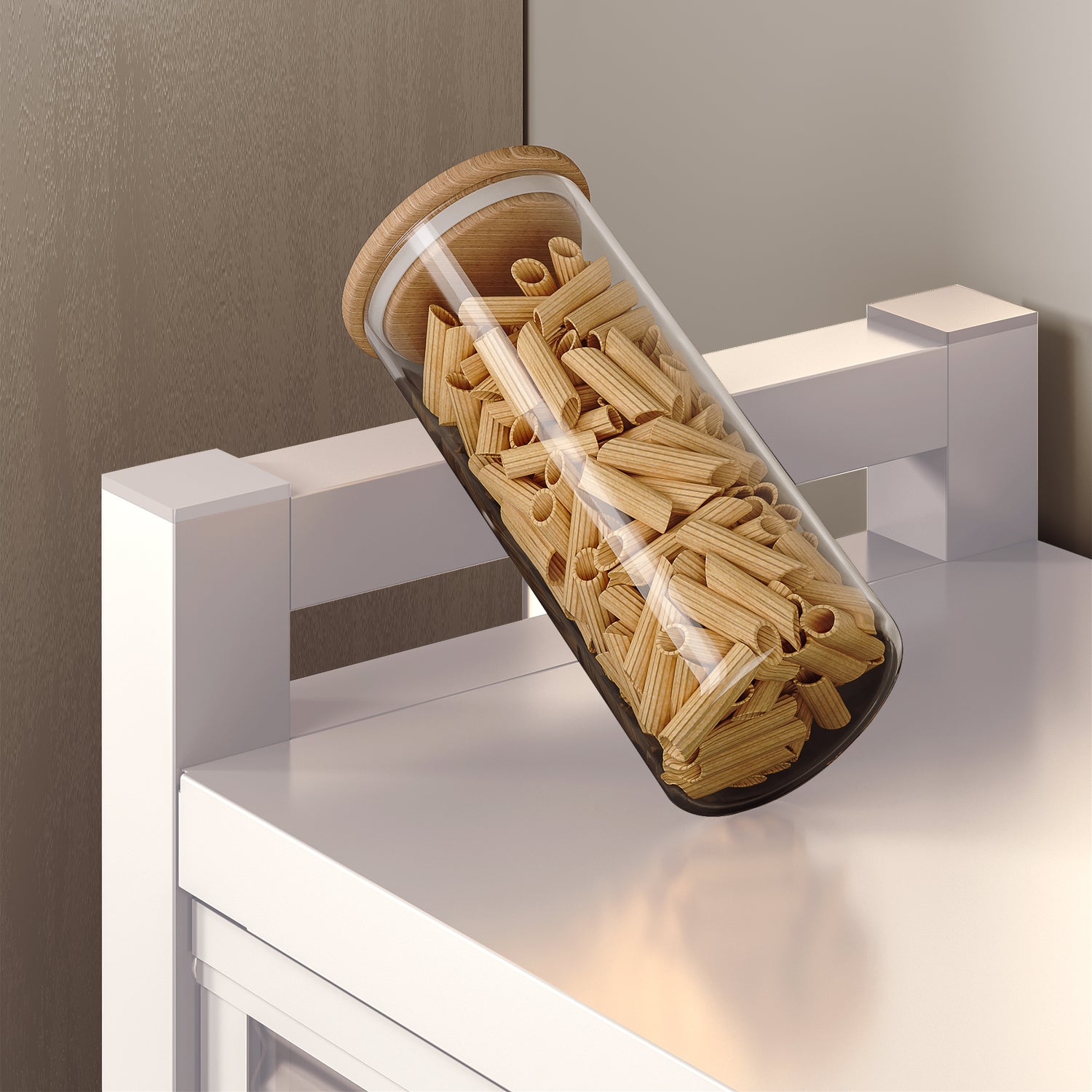 Glass jar filled with pasta resting on a kitchen counter with a wooden lid.